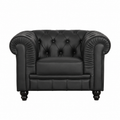 Sillón de diseño en similpiel negra, estructura de madera maciza y espuma de alta densidad.