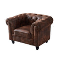 Sillón de diseño Chester en similpiel vintage marrón, estructura de madera maciza y espuma de alta densidad.