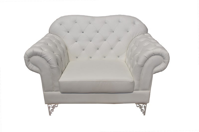 Sillón de diseño LOREN en similpiel blanca con botones brillantes y base de acero inoxidable, perfecto para salones modernos en la Costa Brava