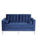 Sofá de dos plazas tapizado en tejido velvet color azul profundo, base de acero inoxidable en acabado brillo y dos cojines de asiento integrados. 