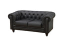 Sofá de dos plazas tapizado en similpiel negra de acabado liso, perfil elegante, dos cojines de asiento integrados y patas oscuras.